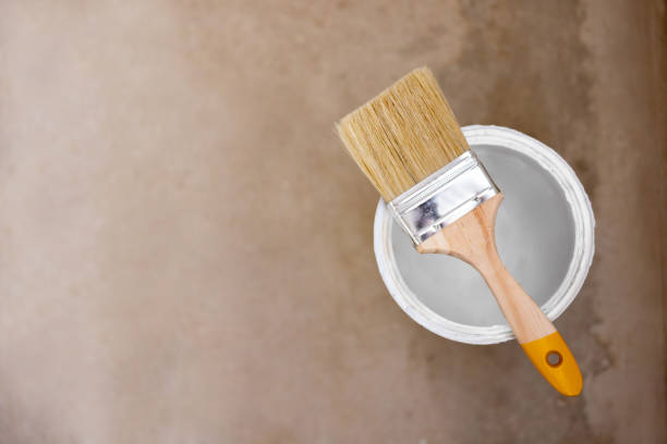 Close-up paint can with a paint brush - home improvement concepts
