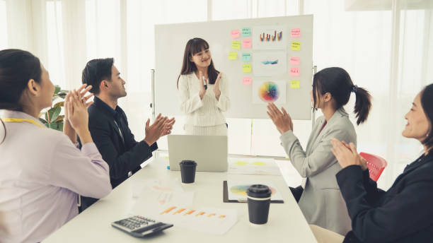istock Businesswoman proficiently present work project receive celebrations from team . Corporate business team collaboration concept . 1466481816