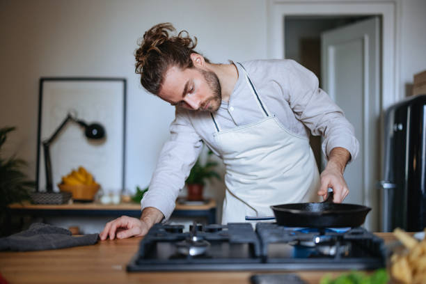 istock Serious Man Making A Healthy Meal In The Kitchen 1466484004