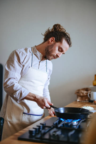 istock Handsome Man Making A Healthy Meal In The Kitchen 1466484109