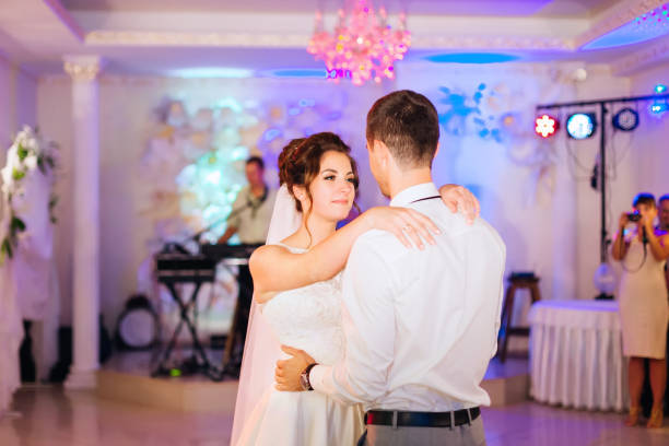 istock newlyweds embracing each other and dancing wedding dance. musici 1466486086
