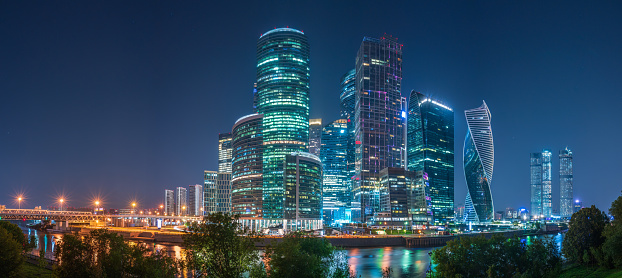 Moscow city at summer night. Modern skyscrapers in Moscow-city downtown, Federation tower, Mercury tower etc. Moscow, Russia - urban background
