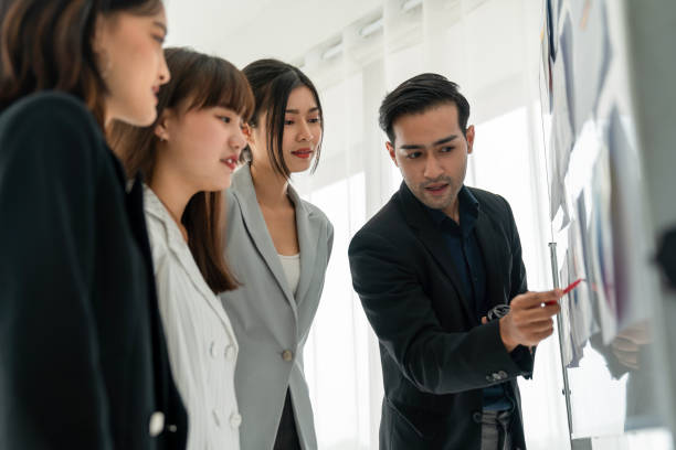 istock Business people proficiently discuss work project while sitting in circle . Corporate business team collaboration concept . 1466487056