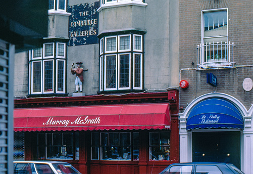 London, England, UK, 1976. The entrance to the Burlington Arcade. Furthermore: pedestrians and shops.