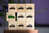 it's time for electric cars, a concept on wooden cubes