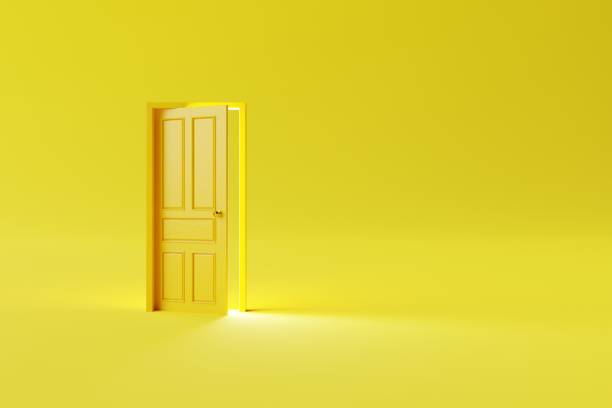 istock The closed yellow door on a yellow background. 1466499514