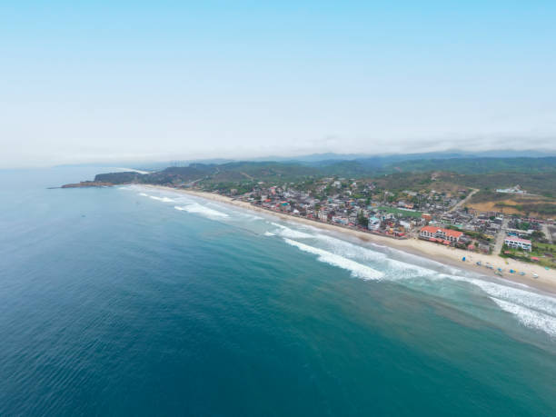 Aerial view of Montanita, a famous tourist destination on the coast of Ecuador with bright blue ocean water, high waves and loads of parties Aerial view of Montanita, a famous tourist destination on the coast of Ecuador montanita ecuador stock pictures, royalty-free photos & images