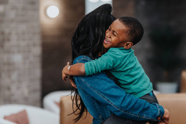 istock Happy little boy giving his mom a hug 1466507364