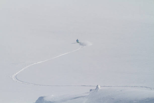 istock Great snowboarding line on white field, freeride winter activity 1466510540