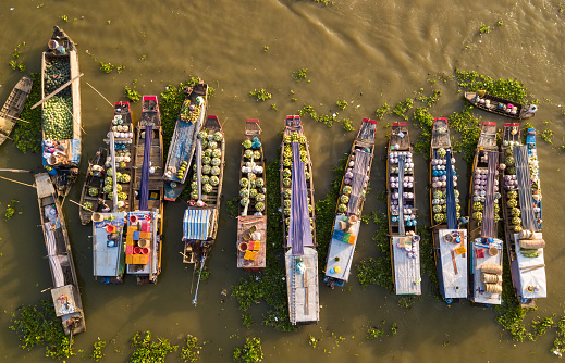 Aerial photo of busy cargo boats on Nga Nam floating market, Soc Trang province