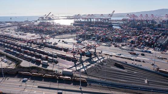Long Beach, California, USA - July 24, 2023: Afternoon sunlight shines on the busy port of Long Beach.