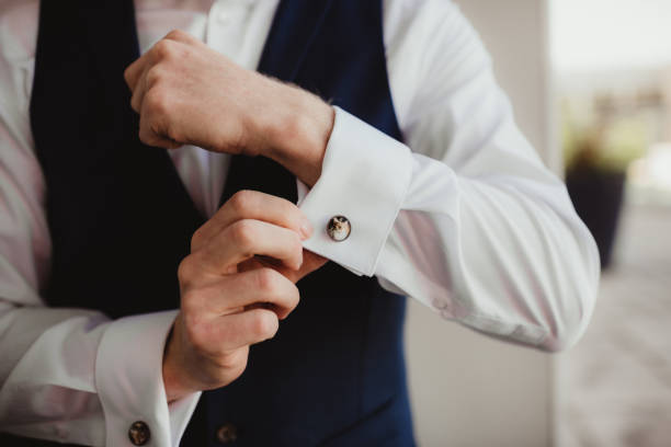 istock Man buttoning his dress shirt 1466517422