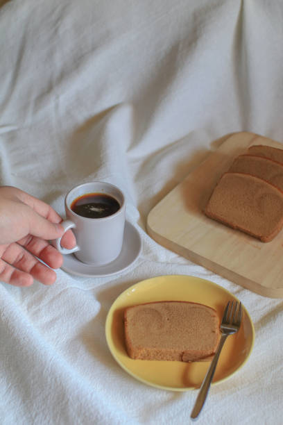 istock Hot coffee with butter bread on white background. Morning Breakfast concept. Minimal vintage tone. Top view flat lay with copy space for your text 1466518903