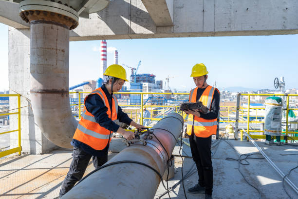 istock Two technicians test equipment in a chemical plant 1466522529