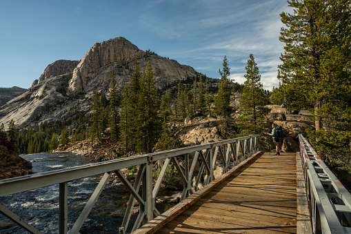 Woman Stops at end of Bridge toward Glen Aulin Campground in Yosemite