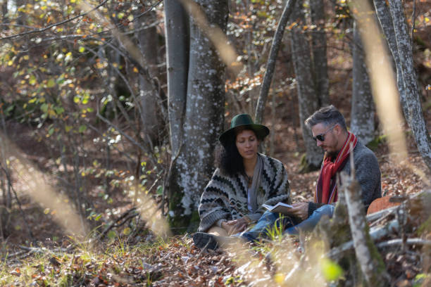 istock Couple sitting in nature. 1466527539
