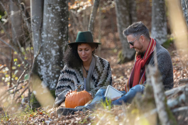 istock Couple sitting in nature. 1466527542