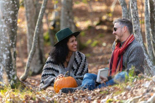 istock Couple sitting in nature. 1466527557