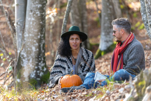 istock Couple sitting in nature. 1466527574