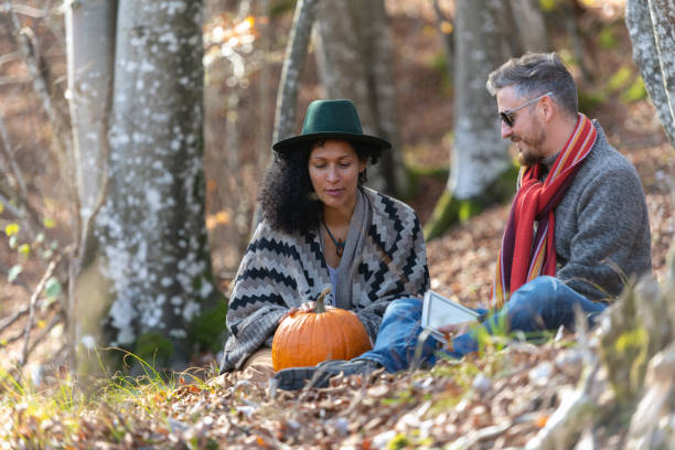 istock Couple sitting in nature. 1466527577