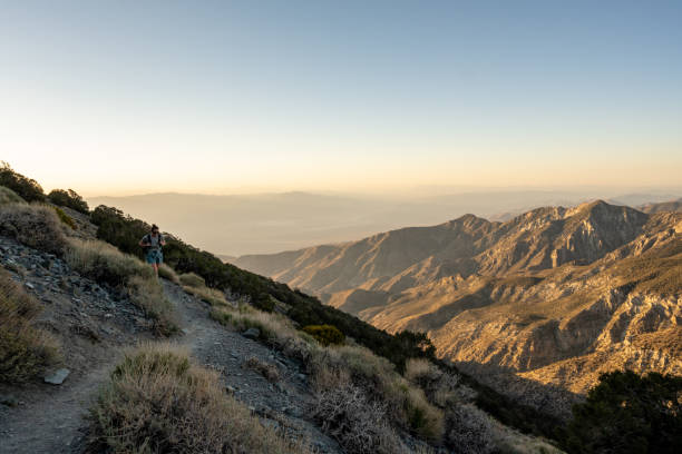istock Woman Turns Corner on Trail toward Telescope Peak 1466527582