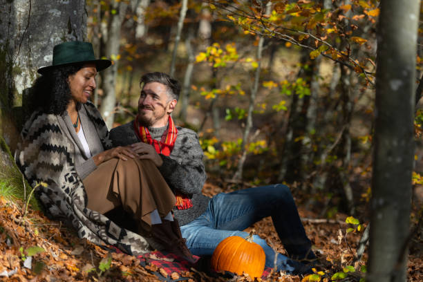 istock Couple sitting in nature. 1466527662