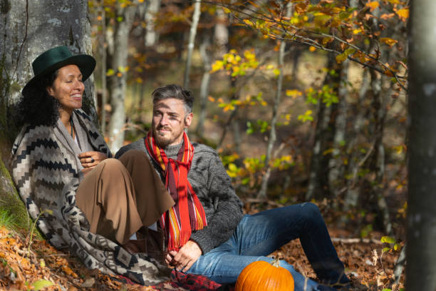 istock Couple sitting in nature. 1466527665