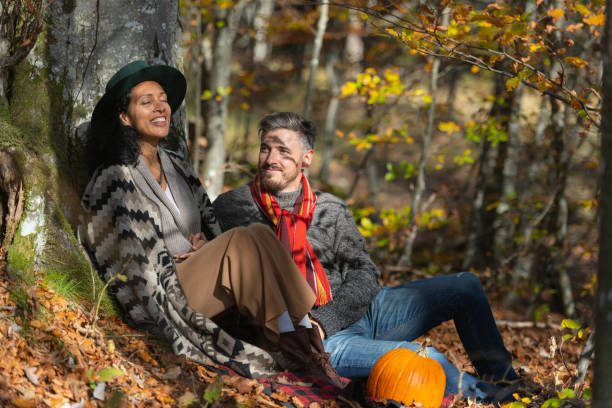 istock Couple sitting in nature. 1466527668