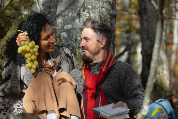 istock A couple eats grapes on a picnic in nature. 1466527707