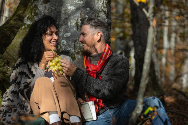 istock A couple eats grapes on a picnic in nature. 1466527713