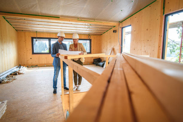 istock Project Leader And Engineer Planning The Initial Phase Of A House Renovation 1466543012