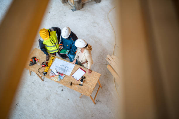 istock Architect And Team Using A Digital Tablet To Edit The Blueprints Of A Project 1466543047