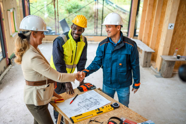 istock Mature Female Project Manager Congratulates Architects For Their Work 1466543077