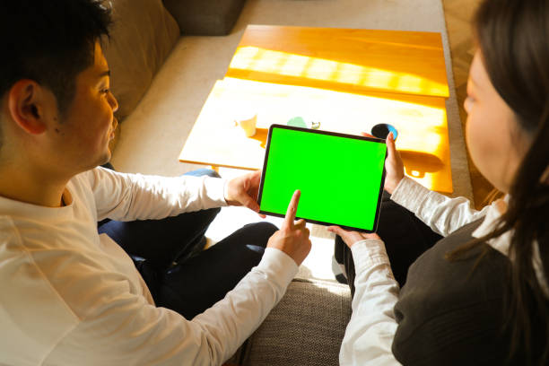 istock Young Family Signing a digital tablet 1466554481
