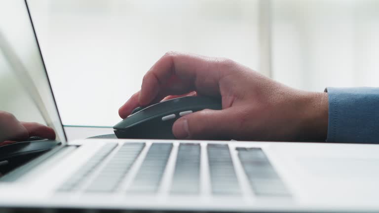 Close Up of Businessman Using Mouse of Computer