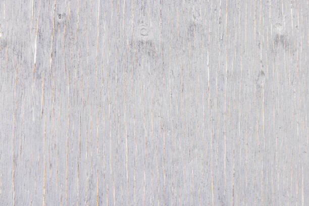 Old weathered plywood with grey paint, abstract background with copy space, full frame horizontal composition