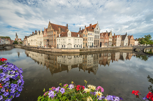 Bruges Belgium, city skyline at Spiegelrei Canal with summer flower