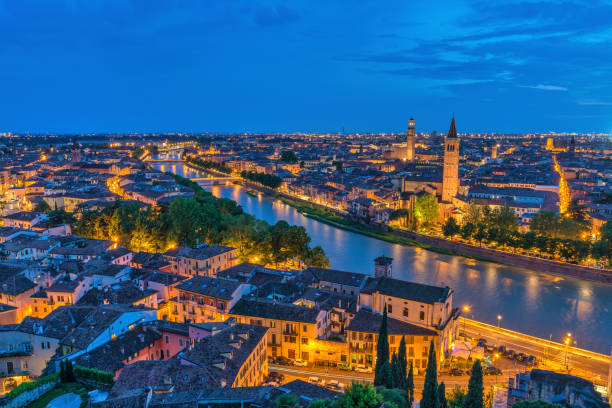 istock Verona Italy, high angle view night city skyline at Adige river 1466558687
