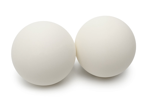 Table tennis balls on white background