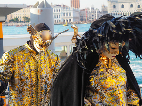 Venice, Italy - February 15, 2020: Beautiful colorful masks at traditional Venice Carnival in Venice, Italy