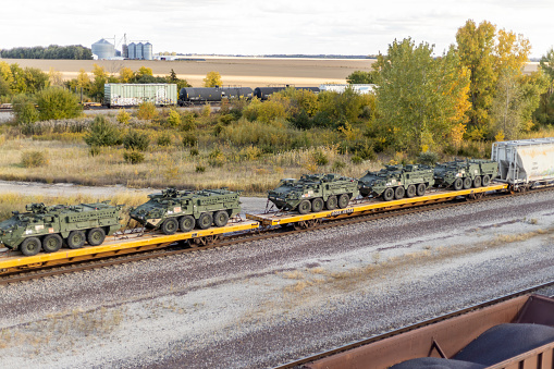 Madison, Wisconsin, USA- 09.18.2022: freight train transporting military machines or tanks