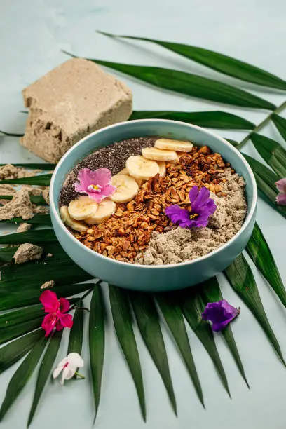 Photo of Smoothie bowl with halva bananas seeds and granola