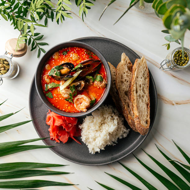 istock Tom yam soup with seafood and rice with toasts 1466578522