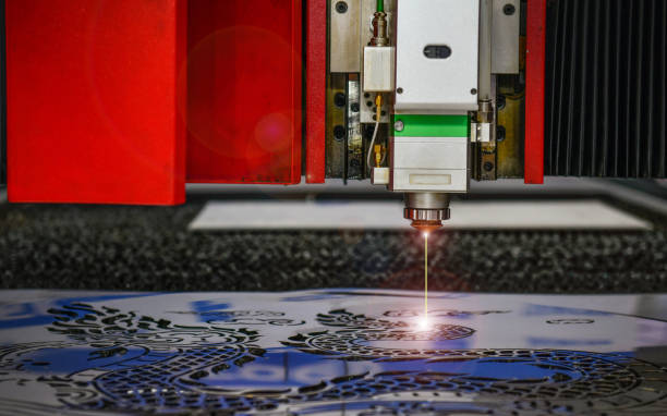 istock laser cut machine while cutting the sheet metal with the sparking light 1466581341