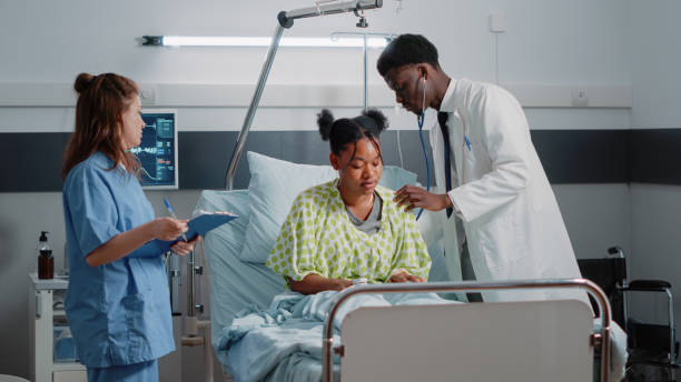 istock African american medic using stethoscope on ill patient 1466581379