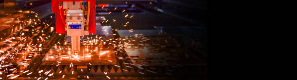 istock laser cut machine while cutting the sheet metal with the sparking light 1466581497