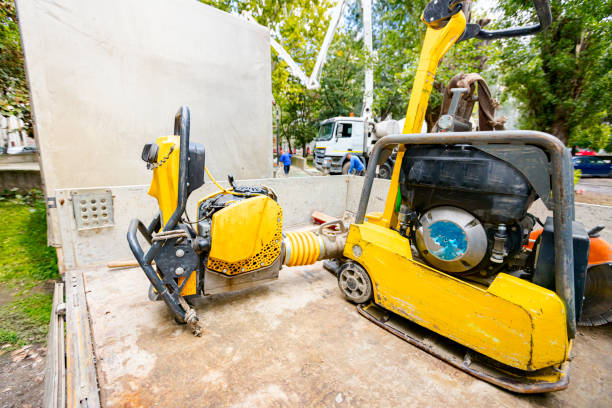 used small yellow rammer standing soil compactor and compacting jumping jack machine at building site - jumping jack compactor imagens e fotografias de stock