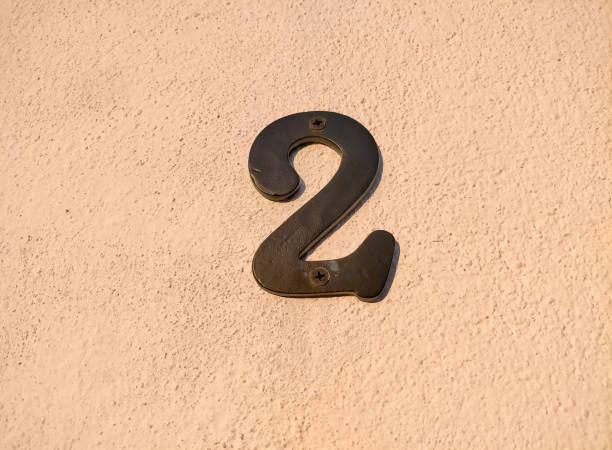 istock number two,2 in black metal number, on a freshly painted white wall 1466592134