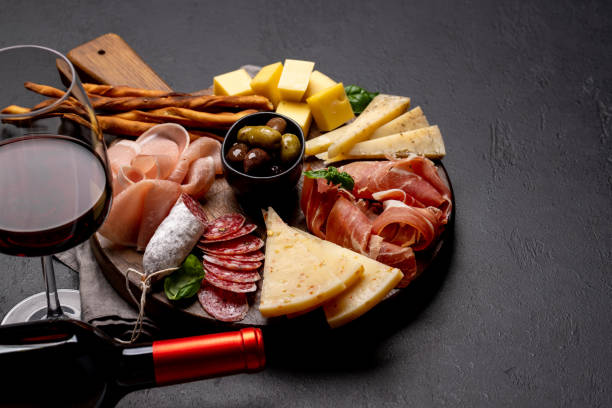 istock Antipasto board with various meat and cheese snacks 1466593099