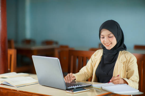 istock beautiful young Asian  woman wearing hijab  at work 1466593990